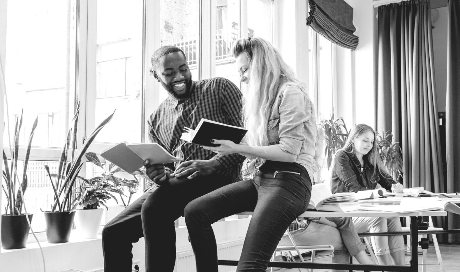 Students collaborating on budgeting exercises in our interactive learning environment