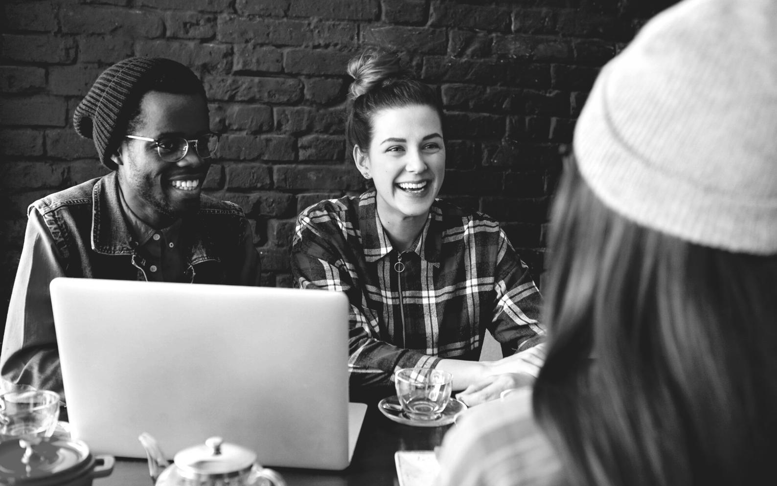 Peer learning workshop with students collaborating on real budget scenarios